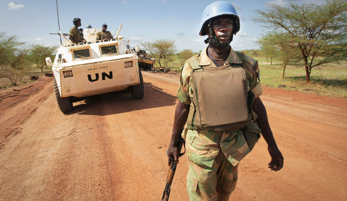 A soldier from Zambia serving with the international peacekeeping operation on the ground during a patrol in the volatile region of Abyei, central Sudan.